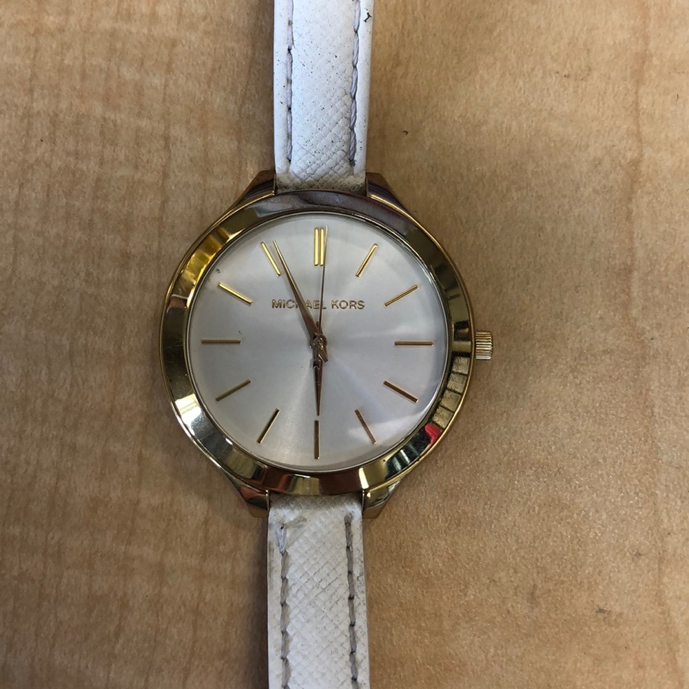 MK white and gold watch.